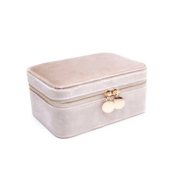 Closed Cream velvet jewellery case viewed at an angle, with gold-tone double zip pulls.