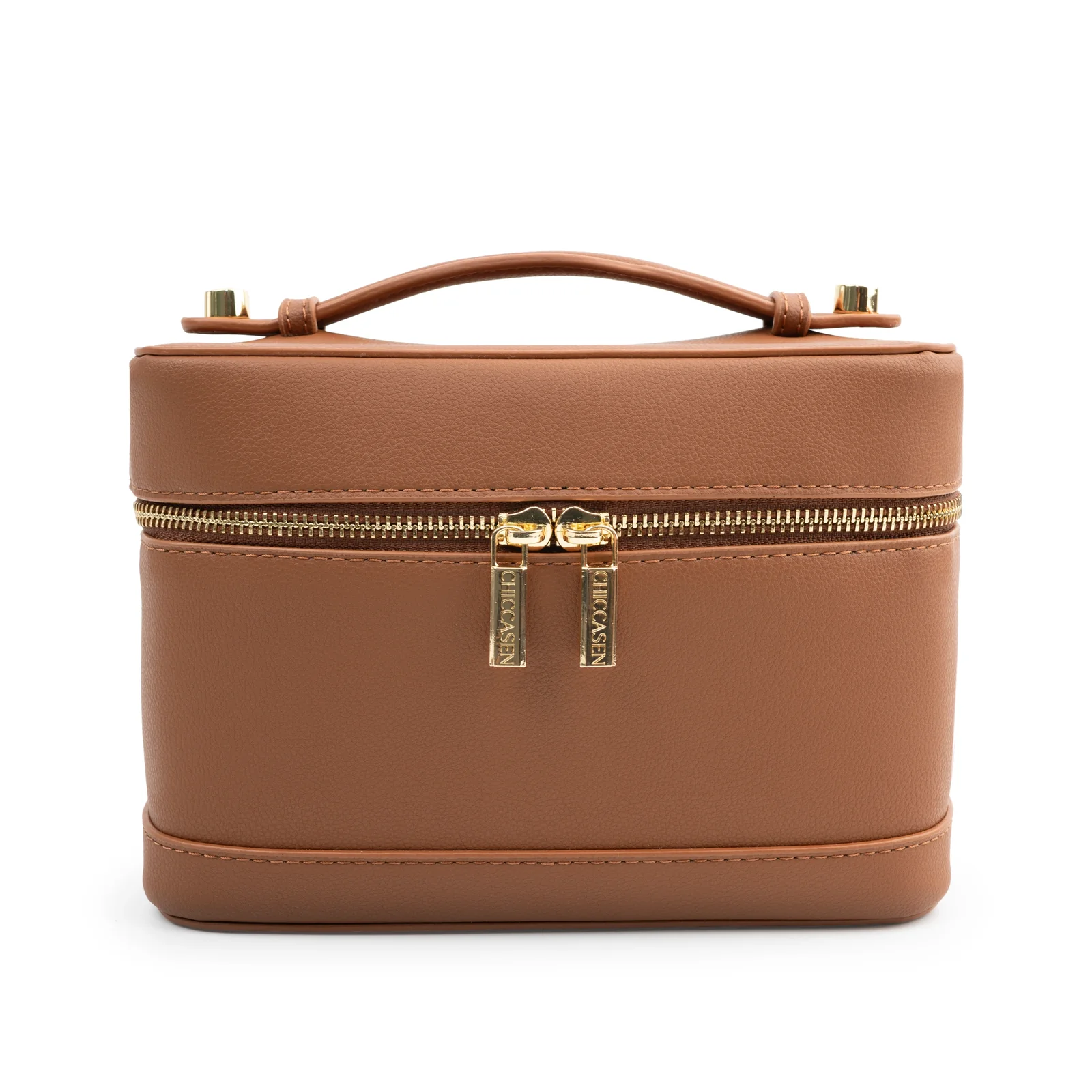 Front view of the closed CHICCASEN Vanity Case in Caramel, showing its curved top handle and gold-tone double zip pulls.